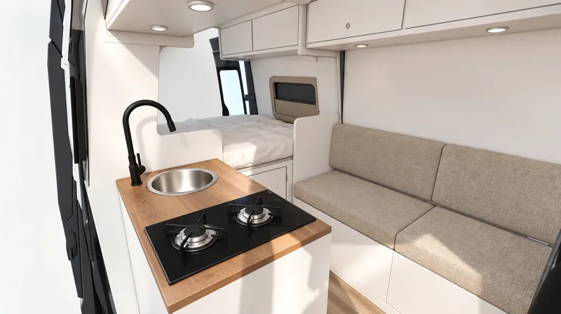 Interior da Van Essencial Curta: cozinha com tampo em teca, banco e cama ao fundo